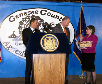 Margo Sue Bittner of The Winery at Marjim Manor, presents a gift basket to Senator Charles Schumer.
